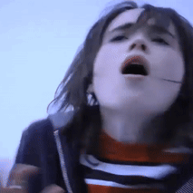 A Close Up Of A Girl With Her Mouth Open GIF
