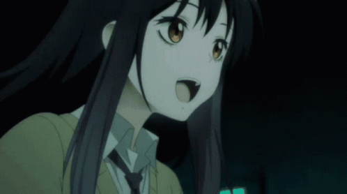 A Close Up Of A Girl With Long Black Hair And A Tie GIF