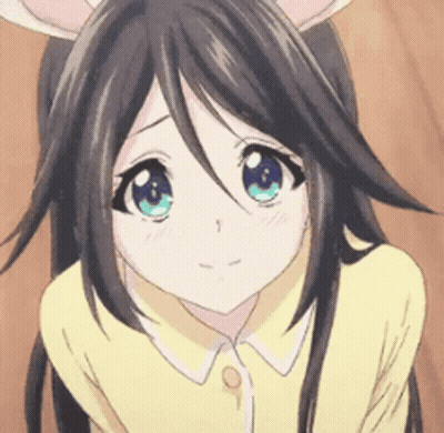 A Close Up Of A Girl With Long Hair And Blue Eyes GIF