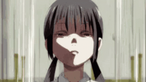 A Close Up Of A Girl With Pigtails Making A Funny Face Behind A Glass Door . GIF