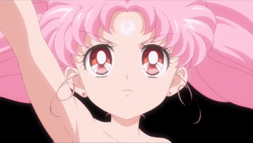A Close Up Of A Girl With Pink Hair And A Crescent Moon On Her Forehead GIF