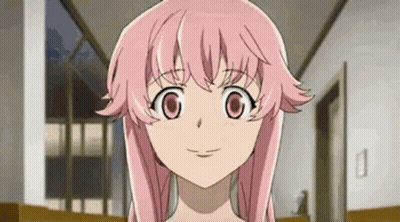 A Close Up Of A Girl With Pink Hair And Big Eyes . GIF