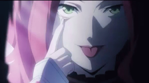 A Close Up Of A Girl With Pink Hair Sticking Her Tongue Out . GIF