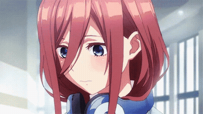A Close Up Of A Girl With Red Hair And Blue Eyes . GIF