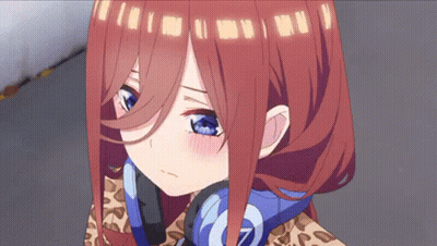 A Close Up Of A Girl With Red Hair And Blue Eyes Wearing Headphones . GIF