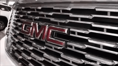 A Close Up Of A Gmc Truck 'S Grille GIF