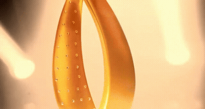 A Close Up Of A Gold Object With Rhinestones GIF