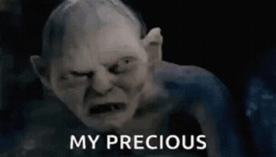 A Close Up Of A Gollum From The Lord Of The Rings With The Words `` My Precious '' Written Next To Him . GIF