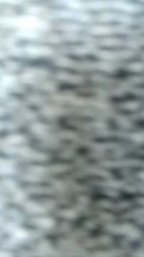A Close Up Of A Gray Background With A Blurred Image Of A Waterfall . GIF