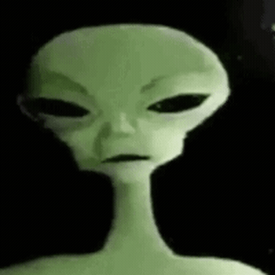 A Close Up Of A Green Alien With Black Eyes And A Long Neck GIF