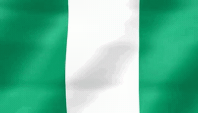 A Close Up Of A Green And White Flag Waving In The Wind . GIF