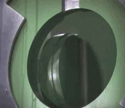 A Close Up Of A Green Circle In A Machine GIF