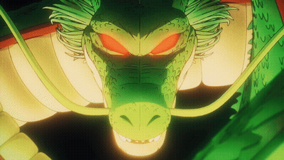 A Close Up Of A Green Dragon With Red Eyes And A Long Tail GIF