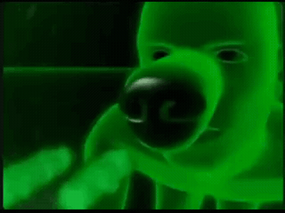 A Close Up Of A Green Monster 'S Face With A Glowing Nose And Mouth . GIF