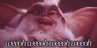 A Close Up Of A Gremlin From The Movie Gremlins Making A Funny Face With Its Mouth Open . GIF
