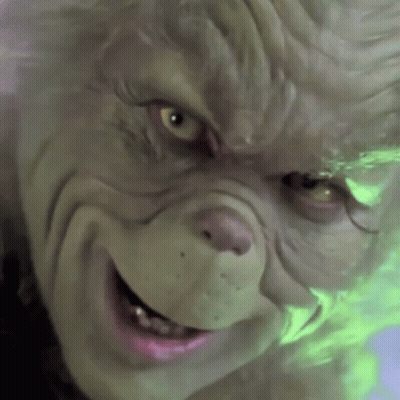 A Close Up Of A Grinch 'S Face With A Smile On His Face GIF