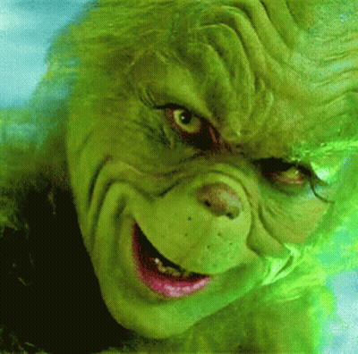 A Close Up Of A Grinch 'S Face With A Smile On It GIF