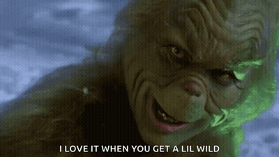 A Close Up Of A Grinch With The Words I Love It When You Get A Lil Wild On The Bottom GIF