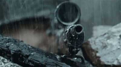 A Close Up Of A Gun In The Rain With Water Coming Out Of It GIF