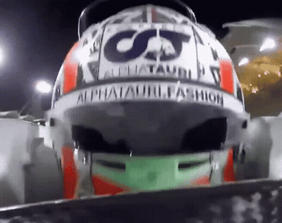 A Close Up Of A Helmet That Says Alphatauri Fashion On It GIF