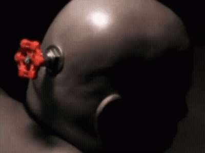 A Close Up Of A Helmet With A Red Valve On The Side GIF