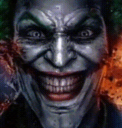 A Close Up Of A Joker 'S Face With A Huge Smile GIF