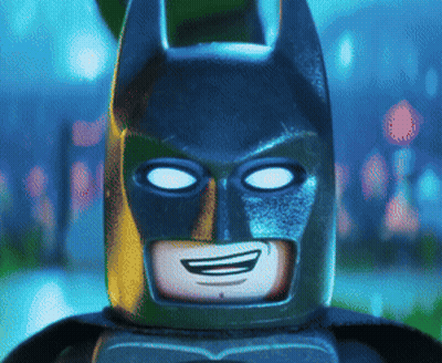 A Close Up Of A Lego Batman Smiling GIF