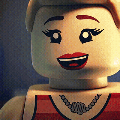 A Close Up Of A Lego Doll With A Necklace That Says Nd On It GIF