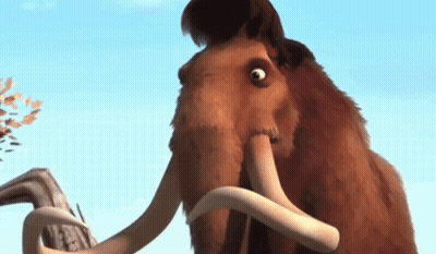 A Close Up Of A Mammoth 'S Face With Its Mouth Open GIF