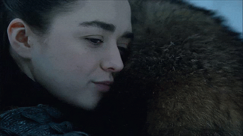 A Close Up Of A Man And A Woman Hugging Each Other GIF