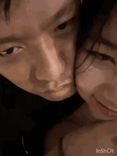 A Close Up Of A Man And A Woman Kissing . GIF