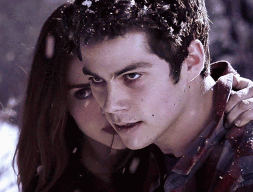 A Close Up Of A Man And A Woman Looking At The Camera GIF