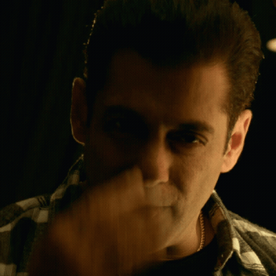 A Close Up Of A Man Covering His Face With His Hand GIF