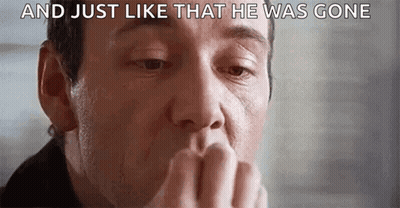 A Close Up Of A Man Covering His Mouth With His Hand And A Caption That Says `` And Just Like That He Was Gone '' . GIF
