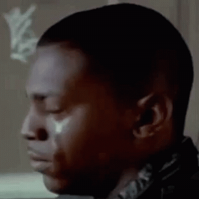 A Close Up Of A Man Crying With A Tear Coming Out Of His Eye . GIF