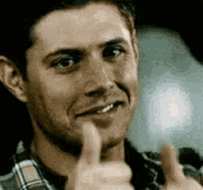 A Close Up Of A Man Giving A Thumbs Up Sign . GIF