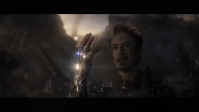 A Close Up Of A Man Holding A Lightning Bolt In His Hand In A Movie Scene . GIF