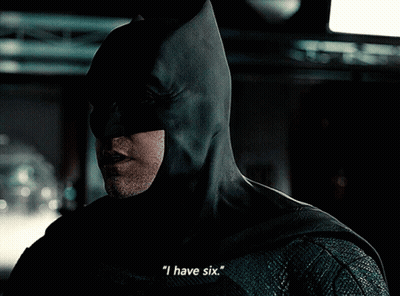 A Close Up Of A Man In A Batman Costume Says " I Have Six " GIF