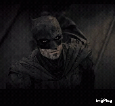 A Close Up Of A Man In A Batman Costume With A Caption That Says Imgplay GIF
