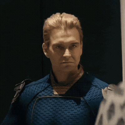 A Close Up Of A Man In A Blue Costume GIF