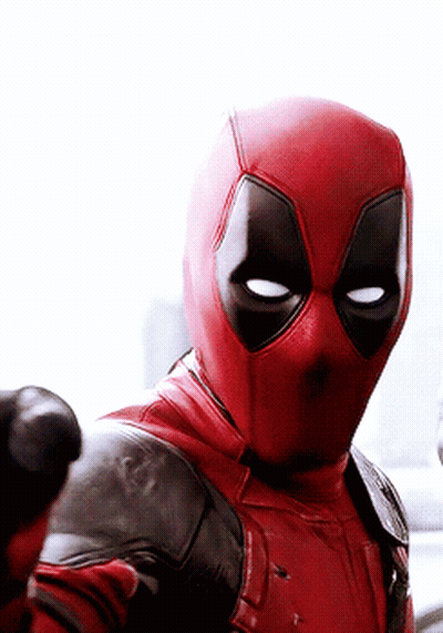 A Close Up Of A Man In A Deadpool Costume Giving A Thumbs Up . GIF