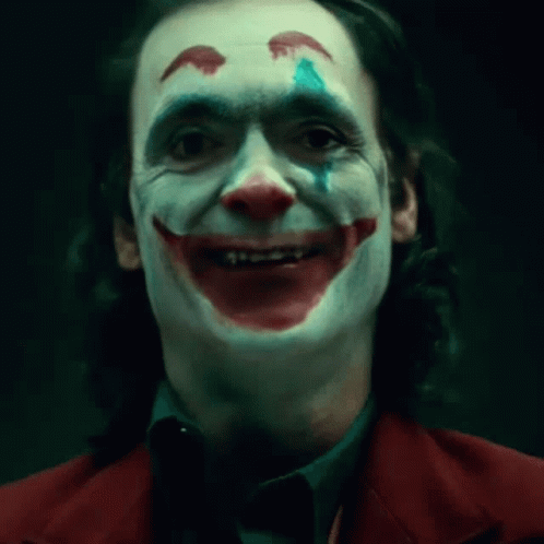 A Close Up Of A Man In A Joker Costume GIF