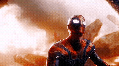 A Close Up Of A Man In A Spiderman Suit With Glowing Eyes GIF