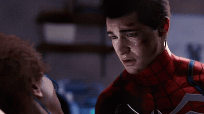 A Close Up Of A Man In A Spiderman Suit With Sweat On His Face GIF
