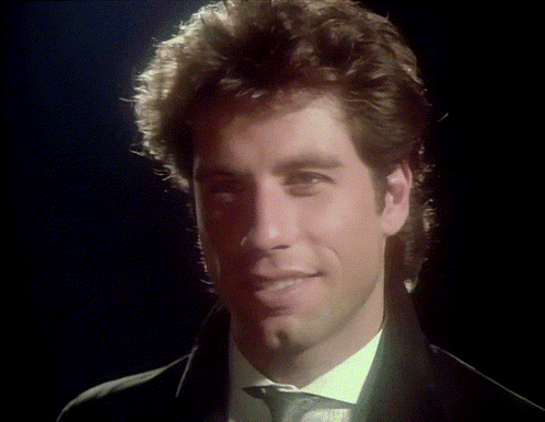 A Close Up Of A Man In A Suit And Tie GIF