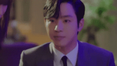 A Close Up Of A Man In A Suit And Tie Making A Face . GIF