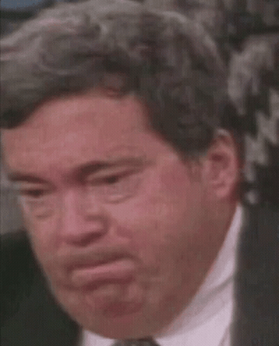 A Close Up Of A Man In A Suit And Tie With A Serious Look On His Face . GIF