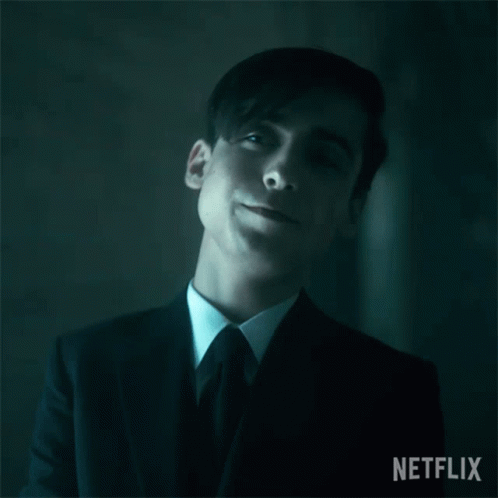A Close Up Of A Man In A Suit And Tie With His Eyes Closed GIF