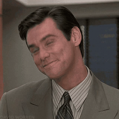 A Close Up Of A Man In A Suit And Tie With The Name David Worren On The Bottom GIF