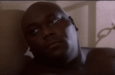 A Close Up Of A Man Laying On A Bed GIF